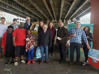 AMEN from St. Basil Orthodox Church in Metairie, LA teaming up with some other Christian charity organizations passing out food to the homeless under the New Orleans Interstate 10.